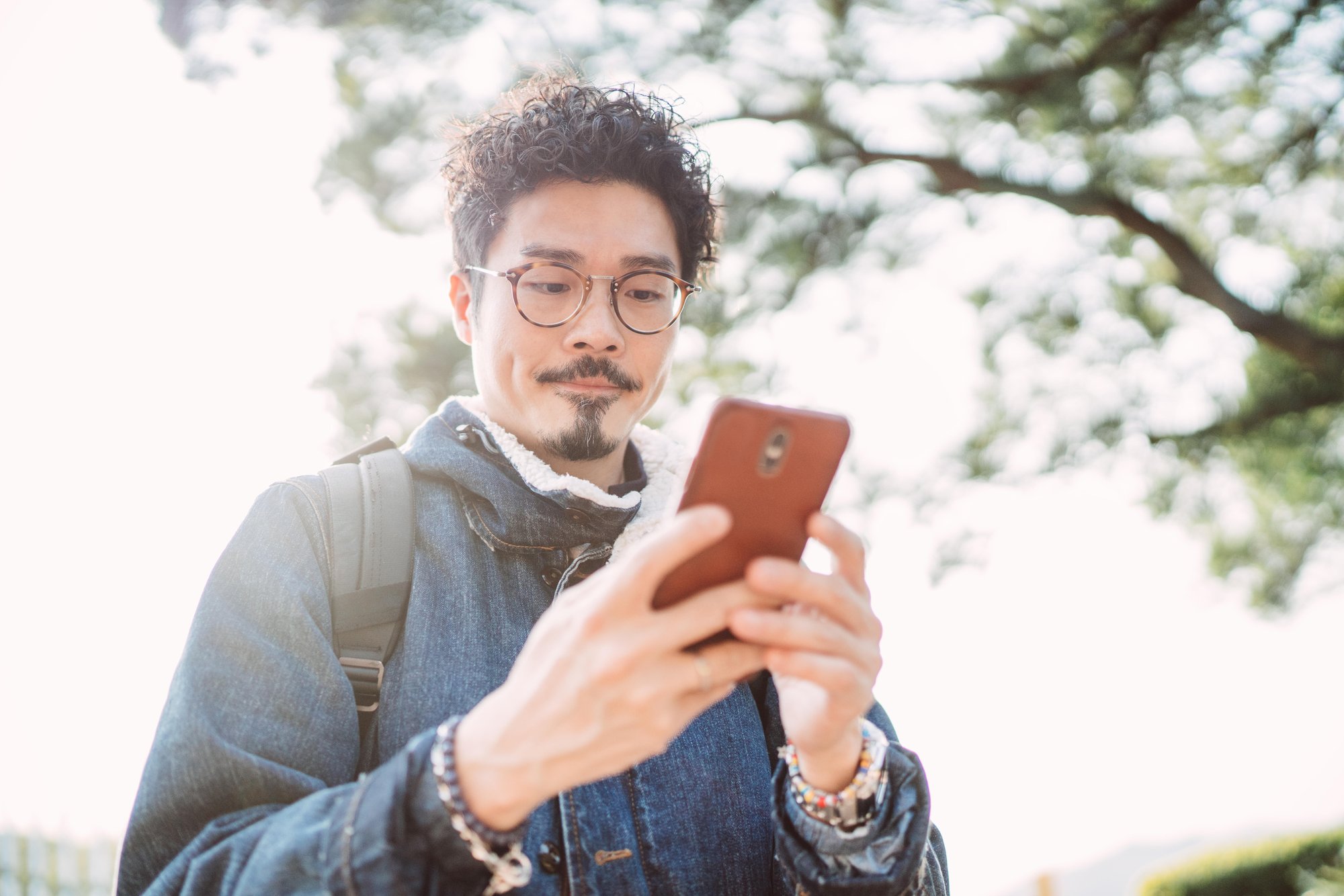 asian man using smartphone phone