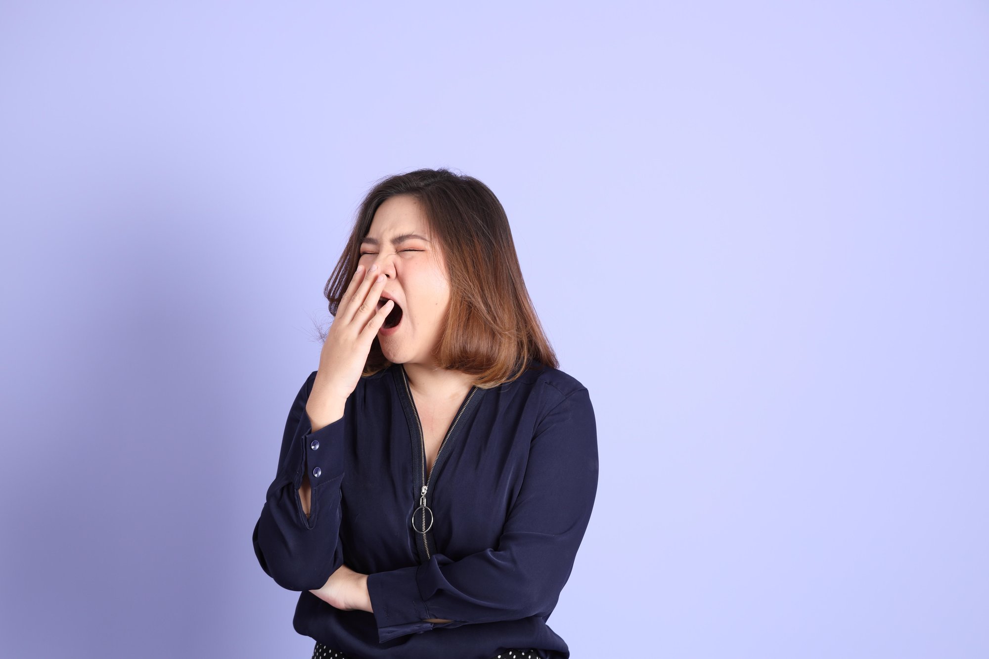 Asian woman yawning