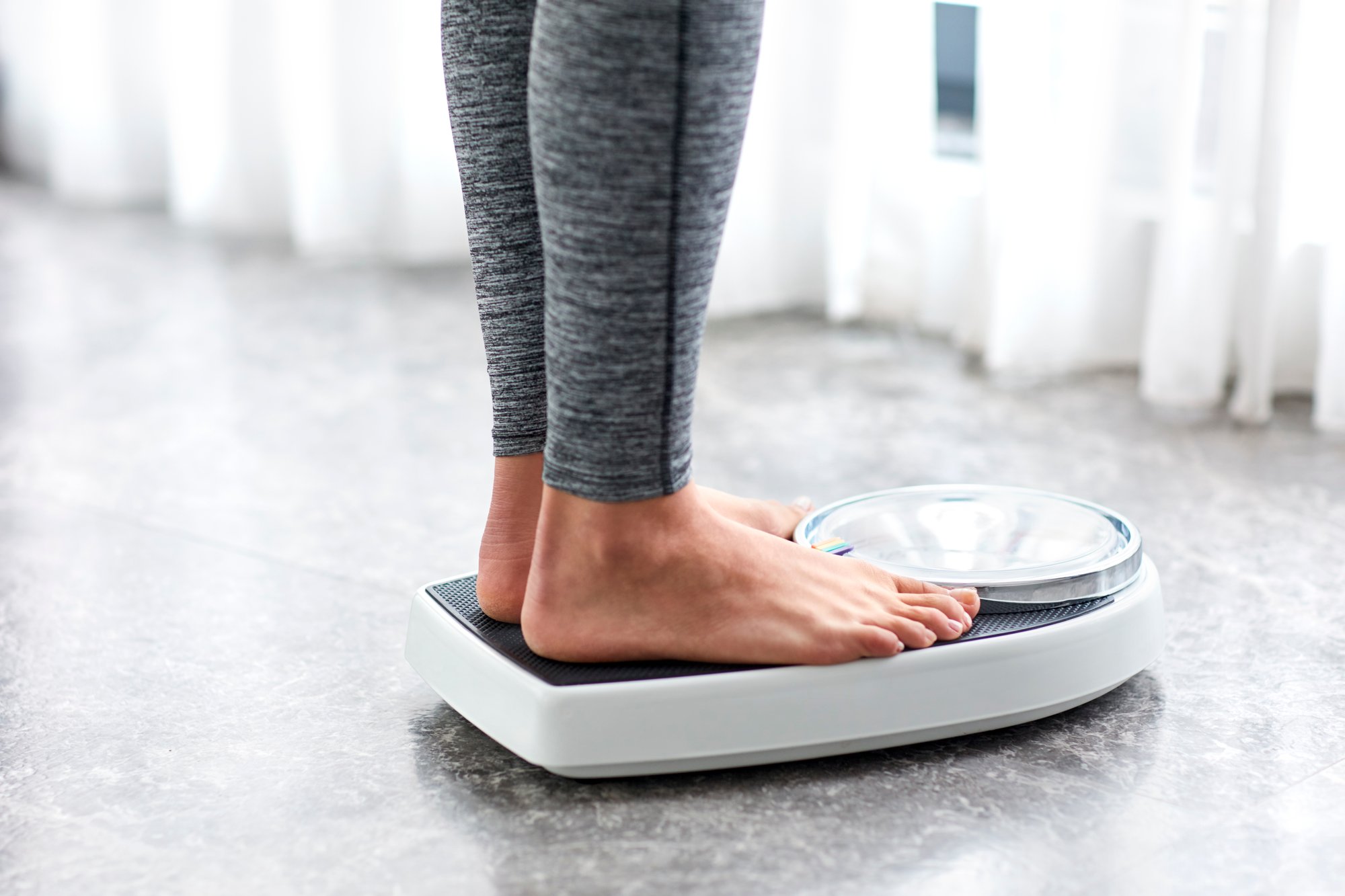 Woman standing on scale